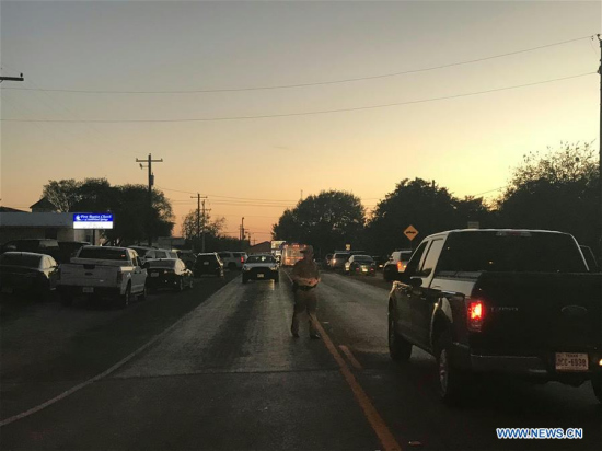 A road near the attack site is blocked by police in Sutherland Springs of Texas, the United States, Nov. 5, 2017. Twenty-six people were shot dead when a gunman opened fire at a church during Sunday services in Sutherland Springs, Texas Governor Greg Abbott said on Sunday. (Xinhua/Liu Liwei)