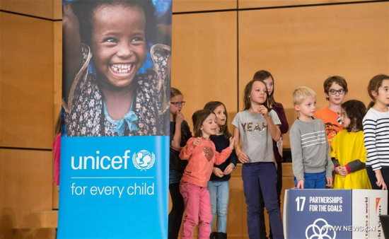 Young students take part in activities to celebrate the World Children's Day in the Palais des Nations in Geneva, Switzerland, on Nov. 20, 2017. (Xinhua/Xu Jinquan)