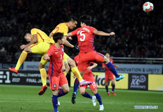 Yu Dabao (C Back) of China competes during the men's football match between South Korea and China at the EAFF E-1 football championship in Tokyo, Japan, Dec. 9, 2017. The match ended 2-2. (Xinhua/Ma Ping)