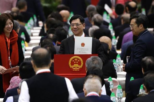 A voter casts his ballot during Hong Kong's 13th National People's Congress electoral council meeting on Tuesday. ROY LIU/CHINA DAILY