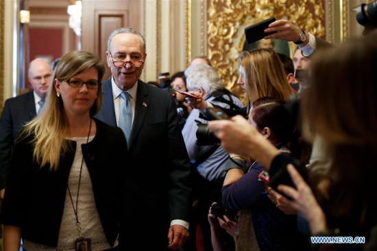 U.S. Senate Minority Leader Chuck Schumer (3rd L) heads to the Senate Chamber before a vote to end government shutdown on Capitol in Washington D.C., the United States, on Jan. 22, 2018. (Xinhua/Ting Shen)