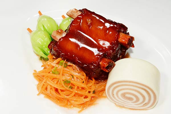 Braised pork ribs are among the signature dishes of Wuxi that are characterized by sweetness. (Photo provided to China Daily)