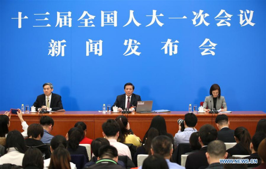 Zhang Yesui (C), spokesperson for the first session of the 13th National People's Congress (NPC), speaks during a press conference on the NPC session at the Great Hall of the People in Beijing, capital of China, March 4, 2018. The first session of the 13th NPC will open in Beijing on March 5. (Xinhua/Jin Liwang)