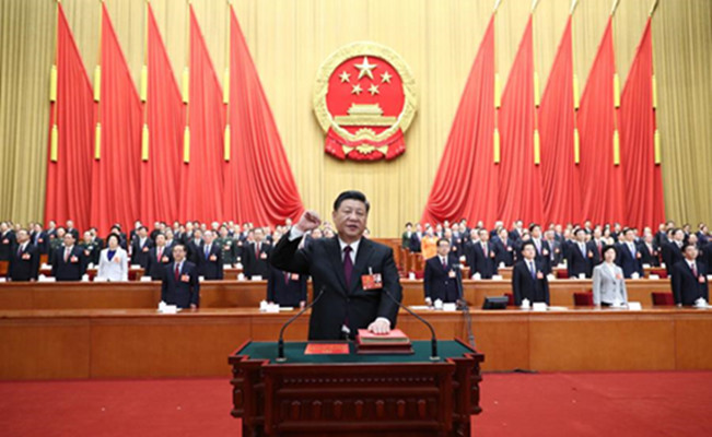 Xi Jinping takes a public oath of allegiance to the Constitution in the Great Hall of the People in Beijing, capital of China, March 17, 2018. Xi was elected Chinese president and chairman of the Central Military Commission of the People's Republic of China earlier Saturday at the ongoing first session of the 13th National People's Congress, the national legislature. (Photo/Xinhua)