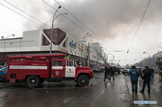 Members of the emergency ministry fire service try to put out the fire at the Zimnyaya Vishnya shopping mall in Kemerovo, Russia, on March 25, 2018. (Xinhua/Sputnik)