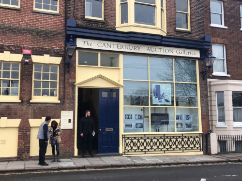 People stand outside Canterbury Auction Galleries on Wednesday after the sale there of a bronze water vessel, known as the Tiger Ying. Photo/China Daily