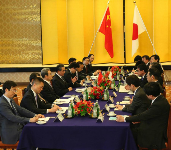 Chinese State Councilor and Foreign Minister Wang Yi (L) meets with Japanese Foreign Minister Taro Kono in Tokyo, Japan, on April 15, 2018. (Xinhua/Lv Shaowei)