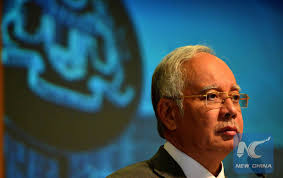 Former Malaysian PM Najib, wife banned from leaving country
