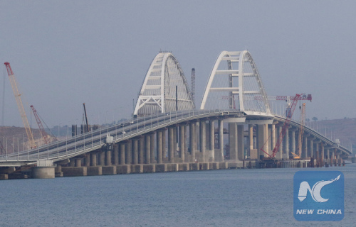 Cars drive along a bridge, which was constructed to connect the Russian mainland with the Crimean Peninsula across the Kerch Strait, May 16, 2018.