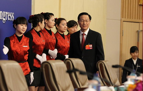 Xie Xuren, minister of finance, gives a news conference on the country's financial policies and financial work on the sidelines of the Fifth Session of the 11th National People's Congress in Beijing on Tuesday. [Photo / China Daily]