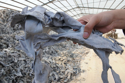 Huge piles of substandard leather scraps at the warehouse of Xueyang Gelatin and Glair Factory in Hengshui, Hebei province, were used to make gelatin that was sold to capsule makers. Wang Min / Xinhua 