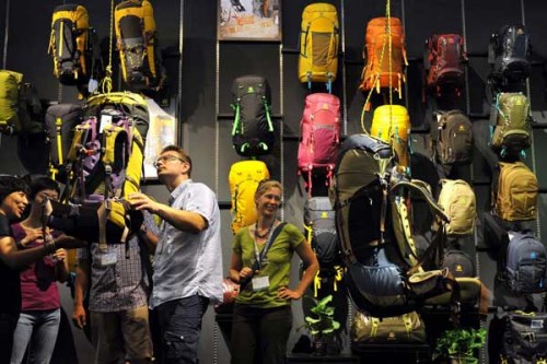 Visitors look at backpacts at the Asia Outdoor Trade Fair in Nanjing, Jiangsu province, July 16. 