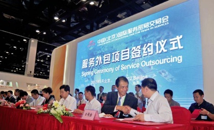 The signing ceremony at the China Beijing International Fair for Trade in Services in May. The country aims to invest in, develop, and promote its service outsourcing business to further tap into international markets to boost the industry's share of fore