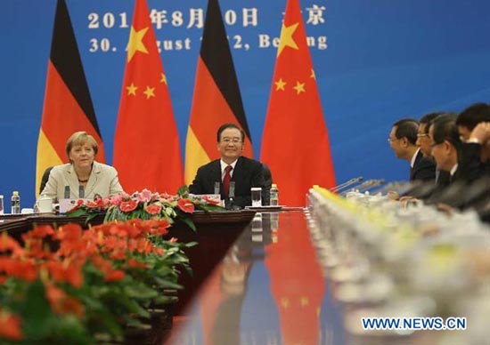 Chinese Premier Wen Jiabao (2nd L) and German Chancellor Angela Merkel co-chair the second round of Chinese-German intergovernmental consultations at the Great Hall of the People in Beijing, capital of China, August 30, 2012. (Photo: Xinhua) 