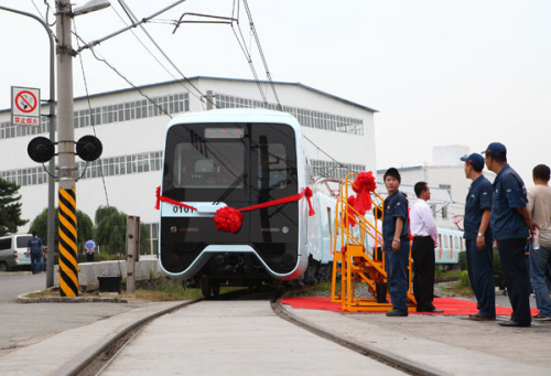 Rail cars manufactured by CNR Changchun Railway Vehicles Co Ltd roll off a production line in Changchun, Jilin province. The cars will be shipped to Harbin, Heilongjiang province, later this month for the city's urban rail-transit system. Zhang Pengfei / for China Daily 