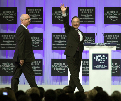 Premier Wen Jiabao and Klaus Schwab, founder of the World Economic Forum, attend the opening ceremony of the Annual Meeting of the New Champions 2012, also known as the Summer Davos, which is taking place in Tianjin.WANG JING / CHINA DAILY