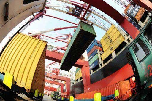 Containers are seen being loaded at Qingdao Port, east China's Shandong province, in September.