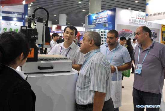 Traders Traders select mechanical products at the 112th China Import and Export Fair in Guangzhou, capital of south China's Guangdong Province, Oct. 15, 2012. The Fair, also known as the Canton Fair, is held biannually in Guangzhou every spring and autumn, with a history of 55 years since 1957. The 112th Canton Fair opened on Monday. (Xinhua/Lu Hanxin)