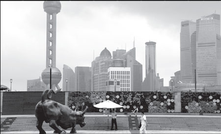 A riverside view of Shanghai's central financial district. Mainland rating agencies are making their steps to Hong Kong. Qilai Shen / Bloomberg