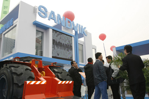 Sweden-based industrial group Sandvik AB displays its equipment at a coal and mining exhibition in Beijing. The company acquired an 80 percent stake in Shanghai Jianshe Luqiao Machinery Co Ltd in October 2011. [Photo by XU XIAOLIN / FOR CHINA DAILY]