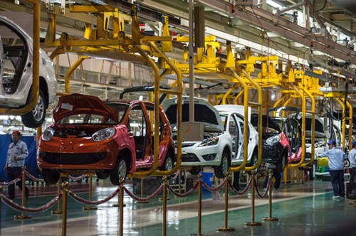 Workers assemble cars at an automobile factory in Chongqing, Southwest China. Steel is the key raw material for automobile manufacturing and accounts for about 85 percent of all the material in a heavy-duty vehicle and for about 64 percent in a family car