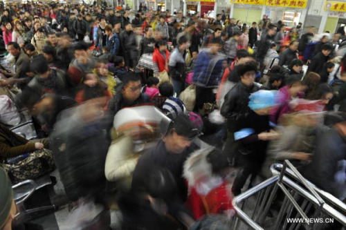 Passengers enter Guiyang Railway Station in Guiyang, capital of southwest China's Guizhou Province, Feb. 15, 2013. (Xinhua File Photo/Ou Dongqu)