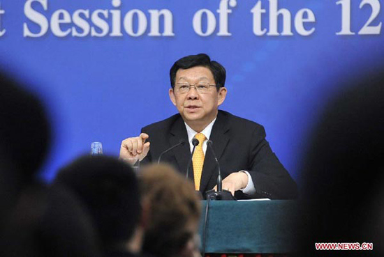 Chinese Minister of Commerce Chen Deming speaks at a press conference held by the first session of the 12th National People's Congress (NPC) in Beijing, capital of China, March 8, 2013. (Xinhua/Wang Peng)