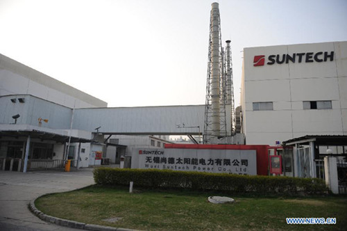 Photo taken on March 17, 2013 shows the entrance of a Suntech Power factory in Wuxi, east China's Jiangsu Province. China's leading solar panel maker Suntech Power, a New York-listed private company based in Wuxi, declared bankruptcy on Wednesday. (Xinhua File Photo)