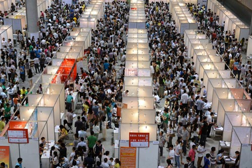 Students and graduates attend a job fair in Chongqing. According to McKinsey research, in 2020, China will have about 24 million fewer high-skilled workers - those with university degrees or advanced vocational training - than it needs. [Zhong Xin/For China Daily]