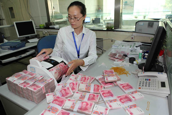 Chinese banks added 860.5 billion yuan ($140 billion) in new yuan loans last month, up nearly 30 percent from May, but less than the 919.8 billion yuan recorded a year earlier, according to the central bank. Si Wei / for China Daily