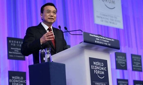 Chinese Premier Li Keqiang addresses the opening ceremony of the Annual Meeting of the New Champions 2013, also known as Summer Davos, in Dalian, Northeast China's Liaoning Province, September 11, 2013. The three-day Summer Davos opened in Dalian on Wednesday. (Xinhua/Pang Xinglei)