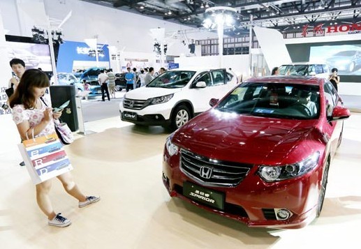 Honda Motor Co vehicles displayed at Auto Beijing 2013 in August. Japanese automakers all reported huge sales surges last month, with Honda leading the list with a gain of 118 percent. Provided to China Daily