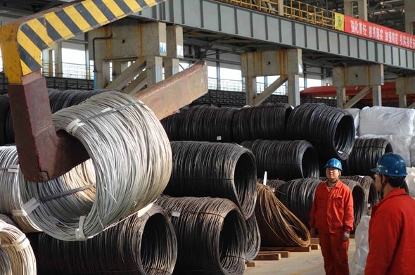 Stainless wires are moved into the warehouse at a specialty steel plant in Dalian, Liaoning province. China is moving to cut excess industrial capacity, especially in the iron and steel, electrolytic aluminum, cement and shipbuilding sectors. Liu Debin / For China Daily  