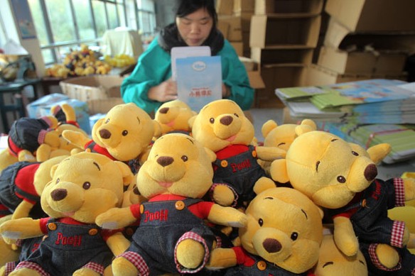 A worker packages toys for export at a factory in Nantong, Jiangsu province. Average annual export growth slowed to 9.4 percent from 2008 to 2012, according to commerce officials. Provided to China Daily  