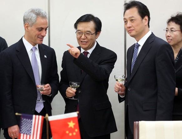 Minister of Commerce Gao Hucheng (middle) and Vice-Minister Wang Chao (right) meet Rahm Emanuel (left), mayor of Chicago. Emanuel is visiting China to promote business opportunities. Zhang Wei / China Daily