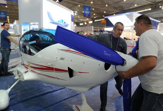 Czech technicians assemble a plane, being displayed at the 2013 Western China International Fair. The potential for commerce and investments between China and the Czech Republic is believed be enormous. Yu Ping / For China Daily  