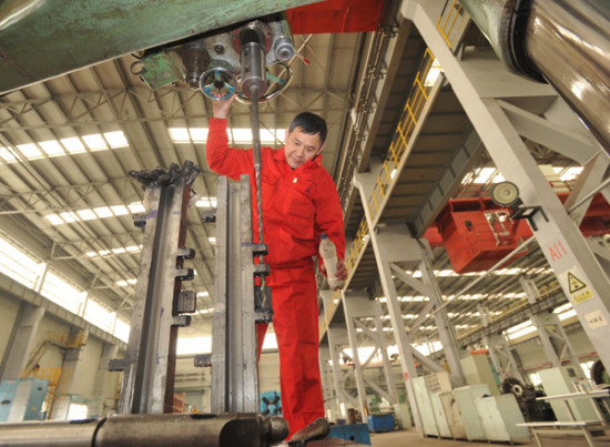 A worker processes products at a company under the Dalian-based Northeast Special Steel Group. (Photo/China Daily)