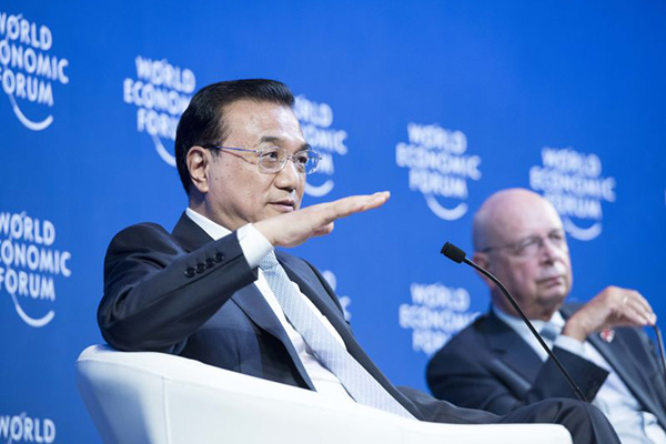 Chinese Premier Li Keqiang speaks with global corporate leaders at the Annual Meeting of the New Champions of the World Economic Forum in Dalian, Liaoning province on September 9, 2015. (Photo provided to China Daily)