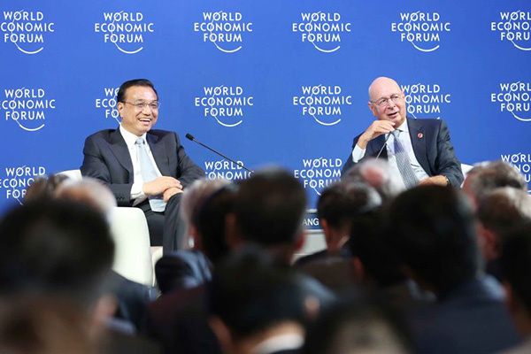 Chinese Premier Li Keqiang speaks with global corporate leaders at the Annual Meeting of the New Champions of the World Economic Forum in Dalian, Liaoning province on September 9, 2015. (Photo provided to China Daily)