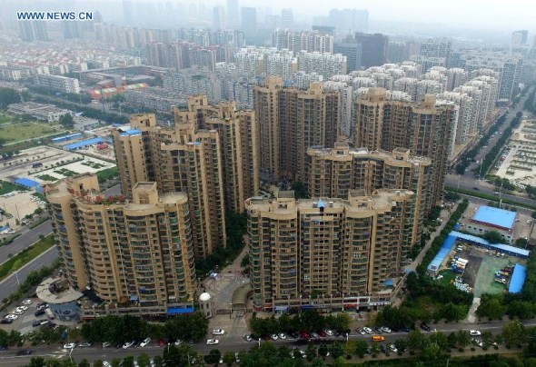 Photo taken on Aug. 17, 2015 shows residential buildings in Zhengzhou, capital of central China's Henan Province.  (Photo: Xinhua/Li Bo)