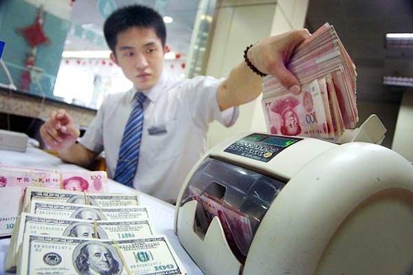 The People's Bank of China cut the reference rate against the U.S. dollar to 6.2298 yuan per dollar, down from 6.1162 yuan a day earlier, the lowest level in more than two years. (Photo provided to China Daily)