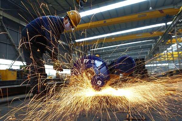 A workshop of Sanway Steel Building Co in Tengzhou, Shandong province. China is still forecast to need a large amounts of iron ore to make steel. In 2015, more than 40 percent of Rio Tinto Group's revenue came from China. (Photo/China Daily)