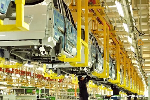 Laborers work at a car factory March 22, 2016 in Huanghua City, north China's Hebei Province. China's GDP stood at 15.9 trillion RMB yuan (2.4 trillion U.S. dollars) in the first quarter this year, growing up by 6.7 percent year on year, the National Bureau of Statistics said on April 15, 2016. (Xinhua/Mou Yu)