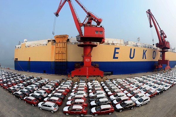 Rows of Chinese automobiles are lined up in Lianyungang Port, Jiangsu province, in January, waiting to be shipped to Brazil. (Photo/China Daily)