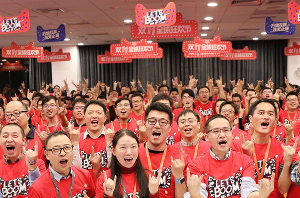 Workers cheer after a rehearsal for the Singles Day (Nov 11) shopping frenzy at the headquarters of Alibaba Group Holding Ltd in Hangzhou, Zhejiang province, on Nov . Provided to China Daily