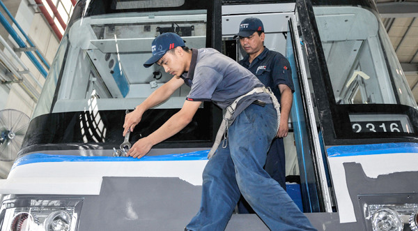 Workers assemble subway trains at CRRC Changchun Railway Vehicles Co in Changchun, Jilin province. (Photo/Xinhua)