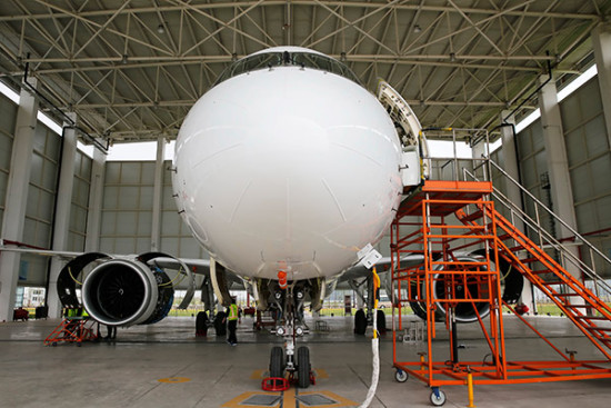 A C919 aircraft undergoes checks in Shanghai after a test flight. [Photo/China Daily]