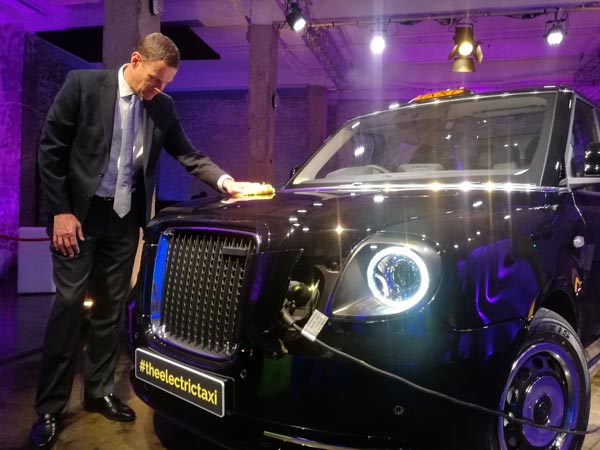 The TX maintains the iconic look of the London black cab, with rectangular grille, circular headlights, strong roofline and curved luggage space. (Photo by Angus Mcneice/China Daily)