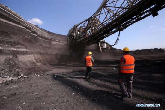 Employees work at Power Public Corporation's South Field lignite mine which is adjacent to Aghios Dimitrios power station at the outskirts of Kozani, Greece, June 6, 2017. (Xinhua/Marios Lolos)