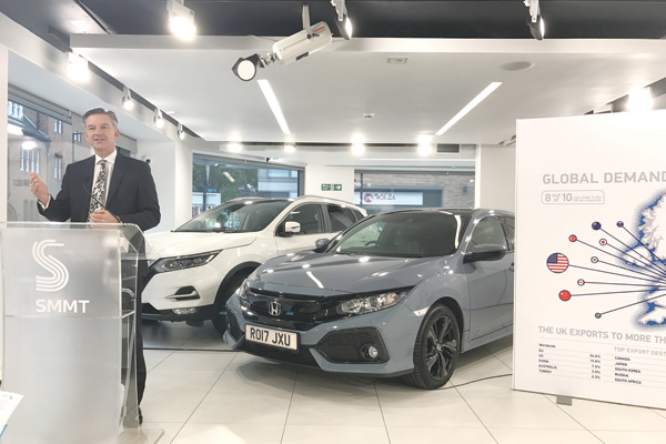 Mike Hawes gives a briefing of UK's auto manufacturing and global exports performance in the first half of 2017. (Photo by Du xiaoying/china daily)